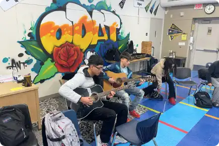 Kids playing guitars